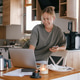 Remote work, Gen Z woman using in cozy kitchen workspace, home office Remote work, Gen Z woman using in cozy kitchen workspace, home office - PhotoDune Item for Sale