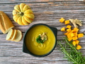 Flat Lay of Butternut Winter Squash Soup on Wooden Surface with Bread and Rosemary Flat Lay of Butternut Winter Squash Soup on Wooden Surface with Bread and Rosemary - PhotoDune Item for Sale
