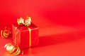 Red Gift Box with Golden Decorations on Red Bacground. Red Gift Box with Golden Decorations on Red Bacground. - PhotoDune Item for Sale