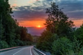 Picturesque landscape with sunset and narrow road in summer mountains Picturesque landscape with sunset and narrow road in summer mountains - PhotoDune Item for Sale
