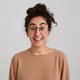 beautiful young woman student with bun of dark curly hair beautiful young woman student with bun of dark curly hair - PhotoDune Item for Sale