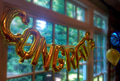 Golden balloons with the word CONGRATS at a graduation party. Golden balloons with the word CONGRATS at a graduation party. - PhotoDune Item for Sale