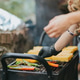 Hands of a woman putting green peppers on the grill alongside Polenta Hands of a woman putting green peppers on the grill alongside Polenta - PhotoDune Item for Sale