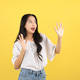Young Indonesian Female Teenager Shocked Happy Expression, Isolated on Yellow Background. Young Indonesian Female Teenager Shocked Happy Expression, Isolated on Yellow Background. - PhotoDune Item for Sale