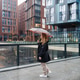 Walking pedestrian holds umbrella on rainy city street. Wet pavement commute, urban travel Walking pedestrian holds umbrella on rainy city street. Wet pavement commute, urban travel - PhotoDune Item for Sale