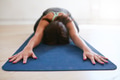 Woman doing yoga in balasana Woman doing yoga in balasana - PhotoDune Item for Sale