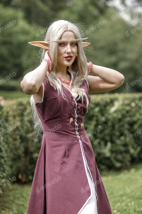 Young elf girl with blond long hair. Medieval elven princess in a burgundy dress in the forest Stock Photo by svetlaya_83 Young elf girl with blond long hair. Medieval elven princess in a burgundy dress in the forest Stock Photo by svetlaya_83