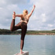Yoga dancer pose on lakeside pier with scenic background Yoga dancer pose on lakeside pier with scenic background - PhotoDune Item for Sale