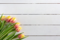 Greeting card template with tulips on a white wooden background, flat lay Greeting card template with tulips on a white wooden background, flat lay - PhotoDune Item for Sale