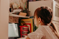 Little girl sitting at table with notebook and doing homework during lockdown. E-learning concept Little girl sitting at table with notebook and doing homework during lockdown. E-learning concept - PhotoDune Item for Sale