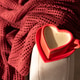 Heart Shaped Coffee Cup on Armchair with Red Blanket. Cozy Valentines Day Still Life Heart Shaped Coffee Cup on Armchair with Red Blanket. Cozy Valentines Day Still Life - PhotoDune Item for Sale