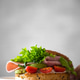 Bagel with butter, ham and avocado in hands at breakfast Bagel with butter, ham and avocado in hands at breakfast - PhotoDune Item for Sale