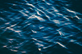 The ocean surface, deep blue water, ripples, sunlight and shade. The ocean surface, deep blue water, ripples, sunlight and shade. - PhotoDune Item for Sale