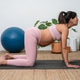 Pregnant Woman Performing Cow Pose Stretch Indoors Pregnant Woman Performing Cow Pose Stretch Indoors - PhotoDune Item for Sale