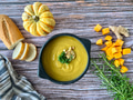Homemade butternut winter squash soup flat lay on wooden surface, served on artisanal dish for Fall Homemade butternut winter squash soup flat lay on wooden surface, served on artisanal dish for Fall - PhotoDune Item for Sale