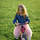 A happy beautiful little girl runs fast and rides her first bicycle without pedals A happy beautiful little girl runs fast and rides her first bicycle without pedals - PhotoDune Item for Sale