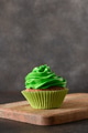 St. Patrick's Day tasty cupcake with green whipped cream. St. Patrick's Day tasty cupcake with green whipped cream. - PhotoDune Item for Sale