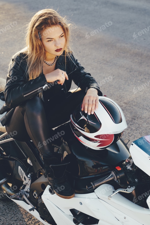 Biker girl in a leather clothes on a motorcycle Stock Photo by arthurhidden Biker girl in a leather clothes on a motorcycle Stock Photo by arthurhidden