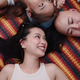 Three thai women friends lying on mat, smiling and enjoying a relaxed moment Three thai women friends lying on mat, smiling and enjoying a relaxed moment - PhotoDune Item for Sale