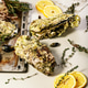 Giant fresh Pacific oysters on a light background. Lemon and oregano. Selective focus. Vertical shot Giant fresh Pacific oysters on a light background. Lemon and oregano. Selective focus. Vertical shot - PhotoDune Item for Sale