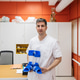 Orthopedist man holding medical braces in clinic Orthopedist man holding medical braces in clinic - PhotoDune Item for Sale