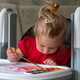 A beautiful little girl with blonde hair draws with paints and a brush. Kid hands A beautiful little girl with blonde hair draws with paints and a brush. Kid hands - PhotoDune Item for Sale