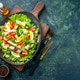 Above view of delicious salad with many fresh ingredients on wooden cutting boa rd spices oil Above view of delicious salad with many fresh ingredients on wooden cutting boa rd spices oil - PhotoDune Item for Sale