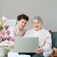 Adult woman explaining senior mother how to use laptop. Education for aged. Adult woman explaining senior mother how to use laptop. Education for aged. - PhotoDune Item for Sale