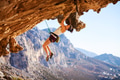 Young female rock climber on a face of cliff Young female rock climber on a face of cliff - PhotoDune Item for Sale