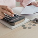 Woman doing home accounting calculating book bank statement for household expense Woman doing home accounting calculating book bank statement for household expense - PhotoDune Item for Sale