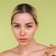 Beauty portrait of young topless woman with bare shoulders on green background with perfect skin and Beauty portrait of young topless woman with bare shoulders on green background with perfect skin and - PhotoDune Item for Sale