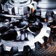 Close up view of interlocking metallic gears rotating smoothly in complex machinery Close up view of interlocking metallic gears rotating smoothly in complex machinery - PhotoDune Item for Sale