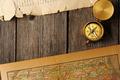 Antique compass over old map Antique compass over old map - PhotoDune Item for Sale