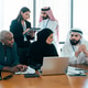 Multiethnic business team collaborating during a corporate meeting in dubai Multiethnic business team collaborating during a corporate meeting in dubai - PhotoDune Item for Sale