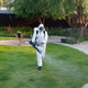 Spring garden pest control: man in protective suit spraying plants Spring garden pest control: man in protective suit spraying plants - PhotoDune Item for Sale