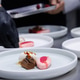plated desserts in professional restaurant kitchen. chef arranges chocolate cake. plated desserts in professional restaurant kitchen. chef arranges chocolate cake. - PhotoDune Item for Sale