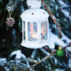 Christmas lantern with candle on branch of snowy winter tree, outdoors Christmas lantern with candle on branch of snowy winter tree, outdoors - PhotoDune Item for Sale