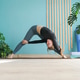 young woman in blue outfit doing variation of Wide Legged Forward Bend Pose young woman in blue outfit doing variation of Wide Legged Forward Bend Pose - PhotoDune Item for Sale