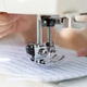 woman sews clothes on sewing machine. manufacture of dresses, shirts. woman sews clothes on sewing machine. manufacture of dresses, shirts. - PhotoDune Item for Sale