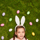 Cute dreamy girl in bunny ears on green meadow Cute dreamy girl in bunny ears on green meadow - PhotoDune Item for Sale
