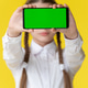 Young girl with braided hair holds horizontal smartphone with green screen for mockup Young girl with braided hair holds horizontal smartphone with green screen for mockup - PhotoDune Item for Sale