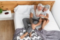 Happy senior couple having tender moments in the bed Happy senior couple having tender moments in the bed - PhotoDune Item for Sale