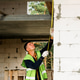 Construction specialist works at window, bricklaying, checks frame fit, alignment tasks Construction specialist works at window, bricklaying, checks frame fit, alignment tasks - PhotoDune Item for Sale