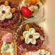 Assorted pastries in box chocolate cream berries and nuts vertical Assorted pastries in box chocolate cream berries and nuts vertical - PhotoDune Item for Sale
