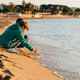 Two school boys kids playing having fun with winter sea waves on the sea shore. Schoolchildren Two school boys kids playing having fun with winter sea waves on the sea shore. Schoolchildren - PhotoDune Item for Sale