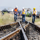 Railway Engineers Inspecting Track Switch Mechanism at Rail Yard Railway Engineers Inspecting Track Switch Mechanism at Rail Yard - PhotoDune Item for Sale