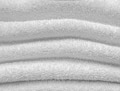 Terry cloth white towel with a folds as a background Terry cloth white towel with a folds as a background - PhotoDune Item for Sale