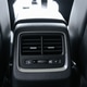 Closeup of a car's rear climate control panel with air vents, heated seat buttons, and USB ports. Closeup of a car's rear climate control panel with air vents, heated seat buttons, and USB ports. - PhotoDune Item for Sale
