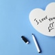 white heart for lettering with inscription I love you and pen on a colored background white heart for lettering with inscription I love you and pen on a colored background - PhotoDune Item for Sale