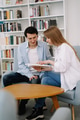 Attractive smiling happy skilled young couple of freelancers sitting at their workplace at home and Attractive smiling happy skilled young couple of freelancers sitting at their workplace at home and - PhotoDune Item for Sale